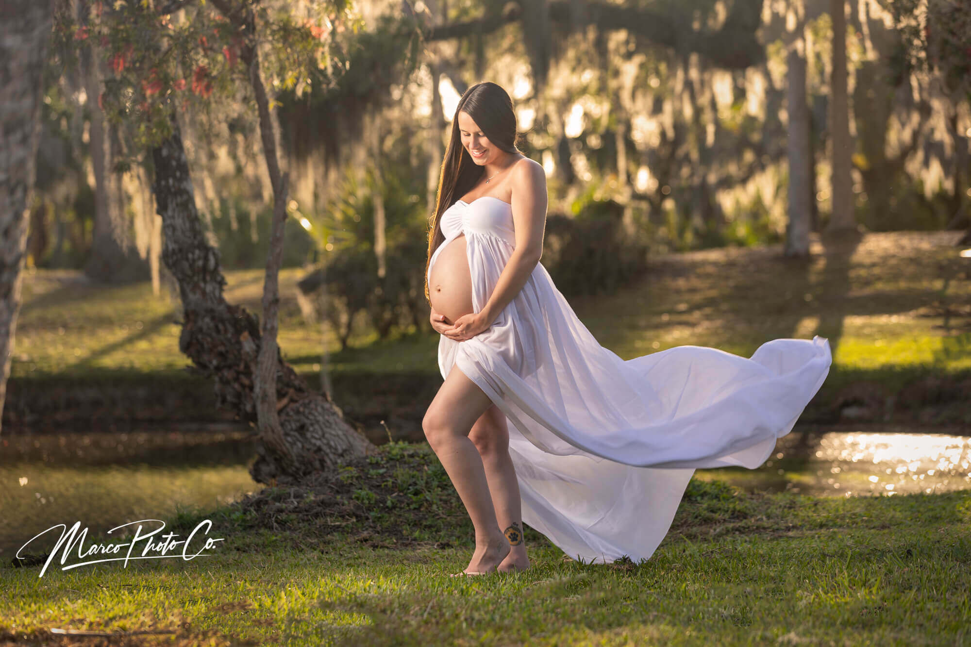 maternity portrait in white dress outdoors